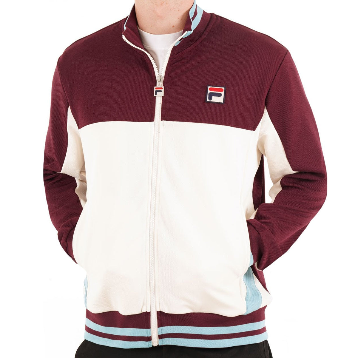 FILA TIEBREAKER FUNNEL NECK TRACK TOP FIG/GARDENIA