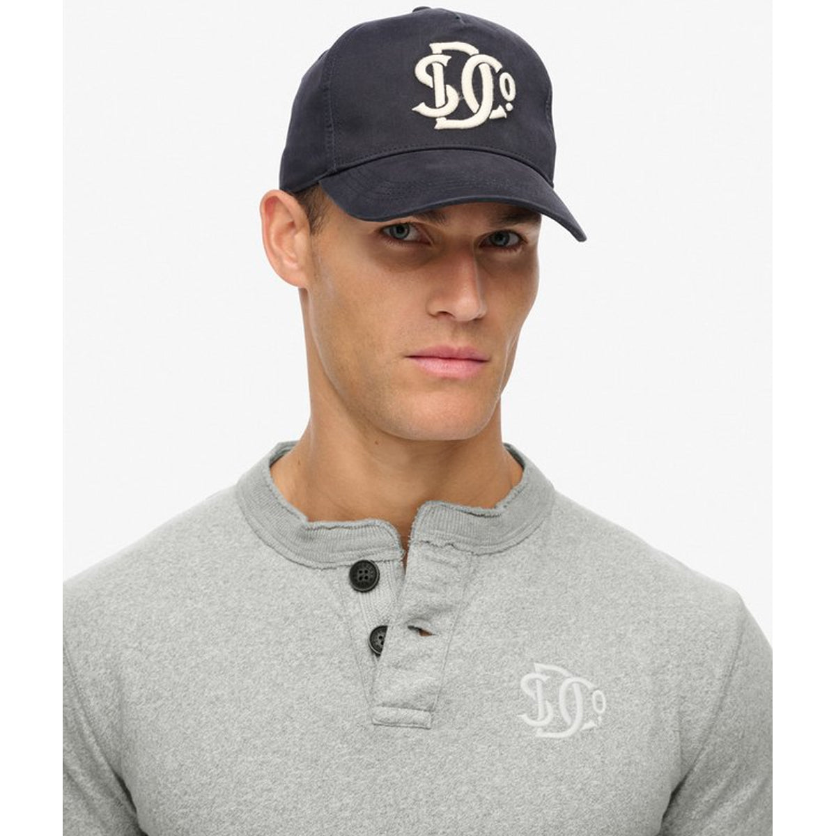 SUPERDRY MERCHANT MONOGRAM TRUCKER CAP VINTAGE ECLIPSE NAVY 98T