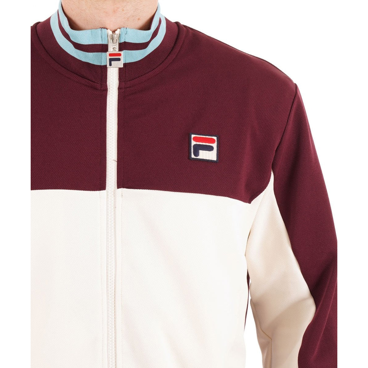 FILA TIEBREAKER FUNNEL NECK TRACK TOP FIG/GARDENIA